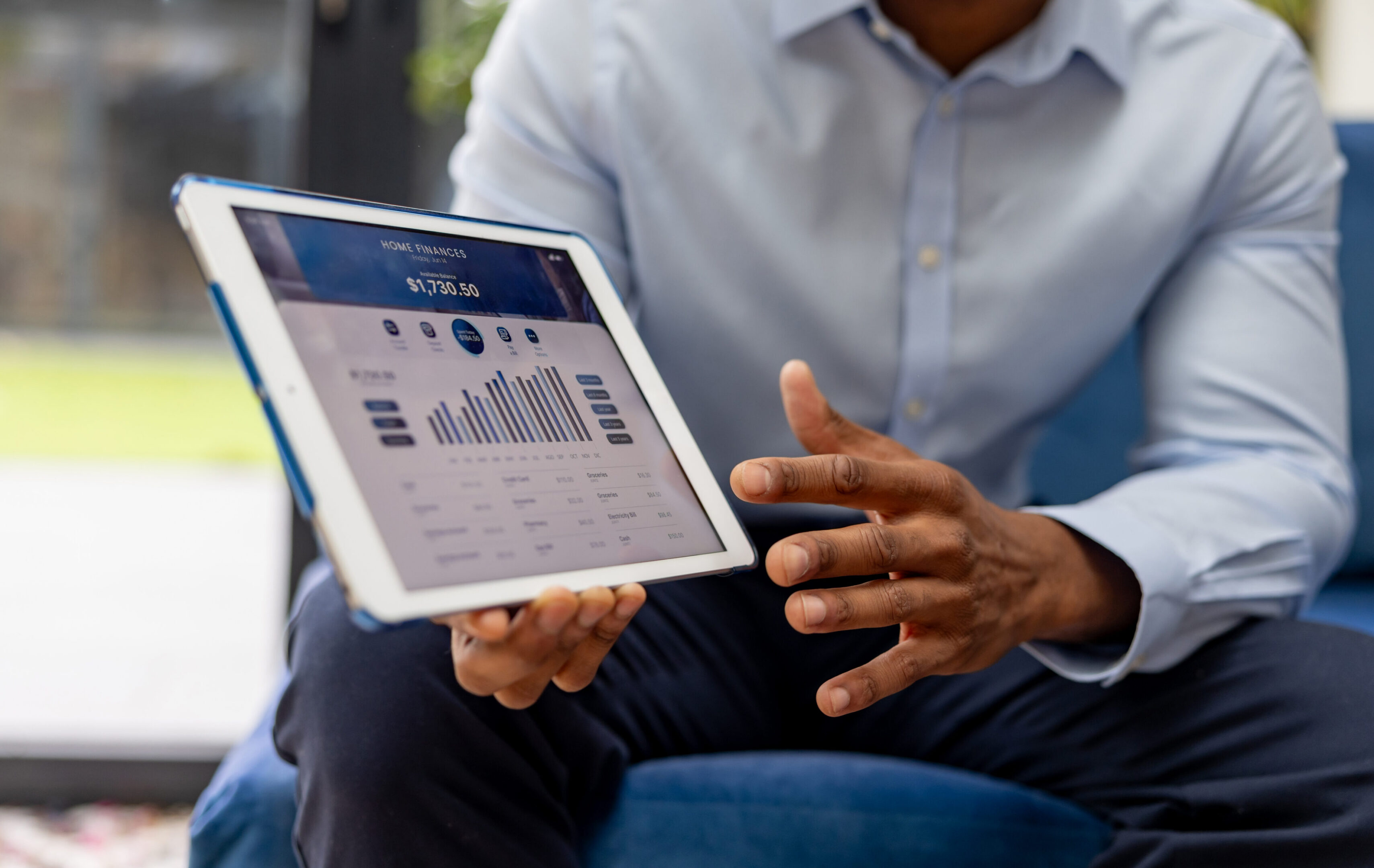 Businessman discussing tablet analytics
