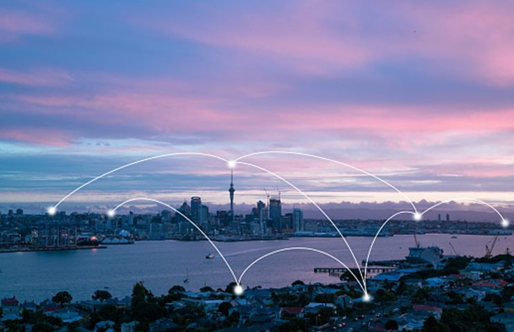City skyline with digital network overlay