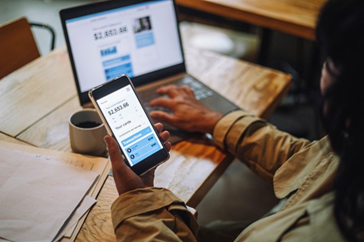Laptop and phone with financial details